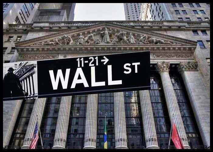 Wall Street reaches record closing highs amid coronavirus slowdown