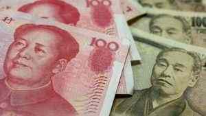 Dollar gains on upbeat manufacturing data, yuan declines over virus concerns