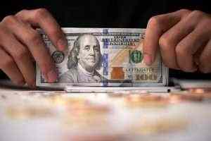 Dollar falls as virus treatment hopes bolster risk appetite