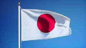 Japan sees easing economic damage, raises outlook
