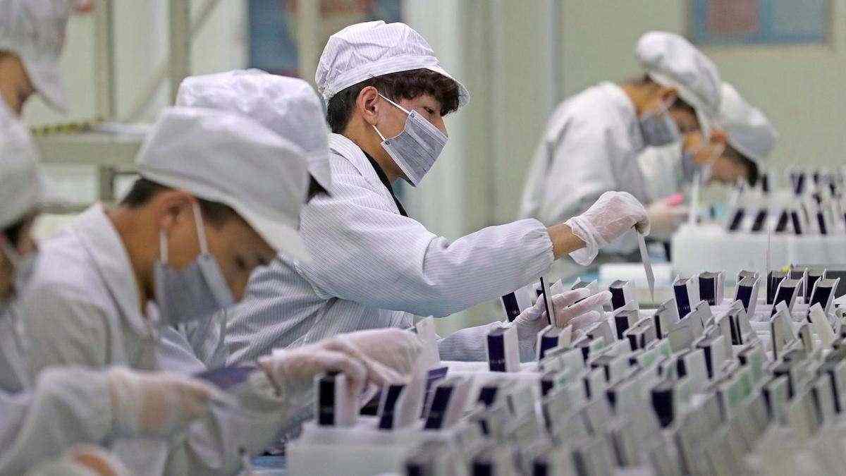 Chinese factory output grows upbeat, consumers remain wary