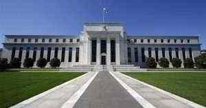 Dollar falls, risk currencies gain on Fed debt buying stimulus