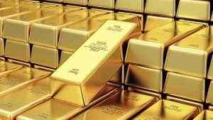 Gold prices fall as it holds ground for eight-year high