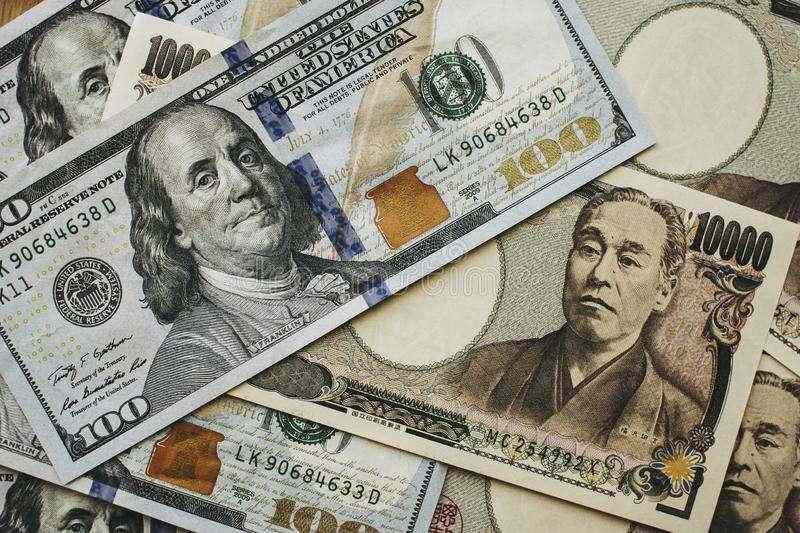 Dollar trades in narrow range, yen drops