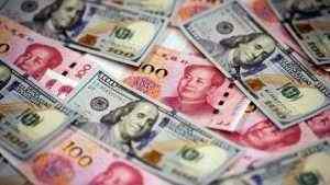 Dollar falls, yuan gains on improved risk appetite