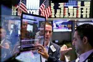 Dow halts rout but still negative amid poor energy and financial data
