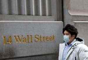 Wall Street declines as COVID-19 restrictions dampen vaccine hopes