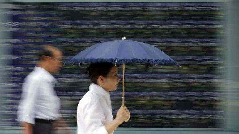 Asian shares plunge as new coronavirus strain weighs