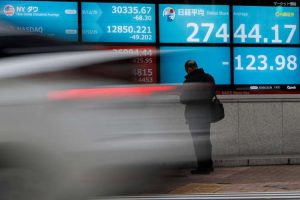 Asian shares jump, dollar hits low grounds on dovish Fed stance