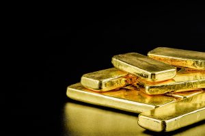 Gold slides but still near its four-month high after fed speech