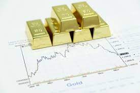 Gold shines as dollar, Treasury yields pulled down by positive U.S. economic data