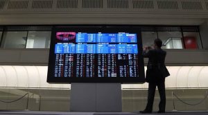 Asian shares ease as U.S. payrolls dampen market mood