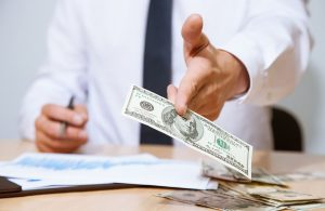 Dollar drops, Fed taper expectations limit loss