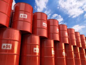 Oil falls as dollar, rig count rises