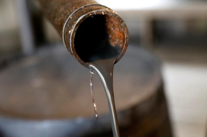 Oil rises over surprise dip in U.S. crude inventory